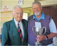  ??  ?? WINNING WAYS: Charles ‘Doc’ Louw, left, presented the winner’s trophy to Hennie Slabbert of Frontier Bowls at the Inter Sub-District Bowls tournament, held at the Kowie Bowls Club on Monday