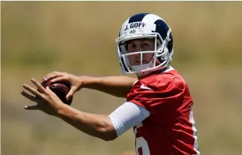  ??  ?? In this June 13 file photo, Los Angeles Rams quarterbac­k Jared Goff passes during practice at the NFL football team’s training camp, in Thousand Oaks. AP Photo/MArk J. terrIll