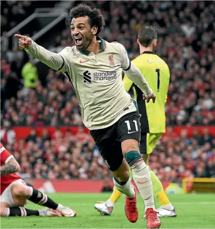  ?? GETTY IMAGES ?? Liverpool’s Mohamed Salah celebrates after scoring the first of his three goals in the 5-0 English Premier League win over Manchester United at Old Trafford yesterday.
