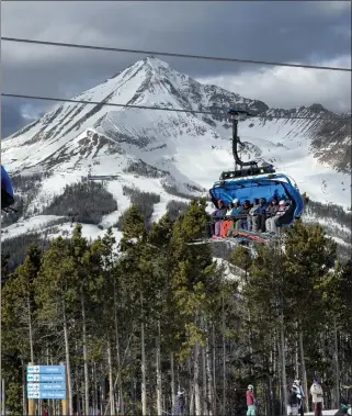  ?? ?? The Ramcharger 8 chairlift carries skiers and boarders up Andesite Mountain, one of four peaks that form Big Sky. The resort is big enough to offer lots of variety to skiers and boarders from beginners to experts, and Big Sky typically gets about 400inches of snow in seasons lasting well into April.