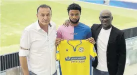  ?? ?? Jamaica internatio­nal Kaheem Parris (centre) displays the shirt of his new club FC Koper in Slovenia recently. Sharing the occasion are club President Ante Guberac (left) and Parris’ agent Kevin Cowan.