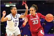  ?? (Photo courtesy LSU Athletics) ?? Arkansas guard Chelsea Dungee (right) is defended by LSU forward Awa Trasi during Sunday’s game in Baton Rouge. Dungee scored 20 points to help the Razorbacks defeat the Tigers 74-64.