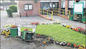  ??  ?? The results of a wrecking spree by a group of vandals who destroyed containers and pulled up newly-planted flowers outside Sapcote Community Library.