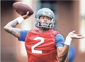  ??  ?? University of Memphis backup quarterbac­k David Moore runs through drills during the first day of practice on July 28, 2017. MARK WEBER/THE COMMERCIAL APPEAL