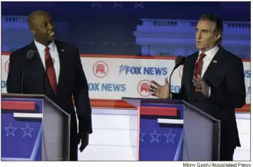  ?? ?? Sen. Tim Scott, R-S.C., left, and North Dakota Gov. Doug Burgum — seen together at a primary debate in August — are former presidenti­al candidates and may be running mates for former President Donald Trump.