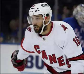  ?? JOHN MINCHILLO — THE ASSOCIATED PRESS FILE ?? Carolina Hurricanes center Vincent Trocheck skates back to the bench after scoring on New York Rangers goaltender Igor Shesterkin during the second period of Game 6of a second-round playoff series in New York. President and General Manager Chris Drury announced Wednesday that the team has agreed to terms with Trocheck on a seven-year contract.