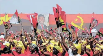  ?? REUTERS ?? PEOPLE’S Movement for the Liberation of Angola (MPLA) supporters cheer at a rally in Luanda. Angolan President João Lourenço’s is seeking a second term in the August 24 vote that observers predict will be the tightest since the oil-rich country emerged from a lengthy civil war two decades ago. |