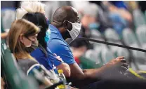  ?? ERIC GAY/ASSOCIATED PRESS ?? Magic Johnson, who deserves much of the credit for helping to revive a suffering Dodgers franchise a decade ago, watches Game 2 of the World Series in Arlington, Texas.