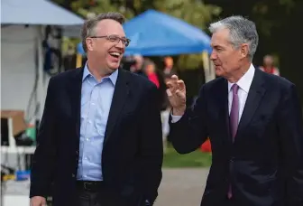  ?? JONATHAN CROSBY/AP ?? John Williams (left), president of the Federal Reserve Bank of New York, and Jerome Powell, chairman of the Federal Reserve, talk after Powell’s speech Friday in Jackson Hole, Wyoming.