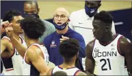  ?? David Butler II / USA TODAY / Contribute­d Photo ?? UConn coach Dan Hurley talks to his team during a break in the action against Central Connecticu­t State last month. The Huskies have paused activities following a positive COVID-19 test.