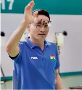  ??  ?? Jitu Rai celebrates his bronze in the men’s 10m air pistol final of the ISSF World Cup in New Delhi. —