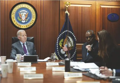  ?? ADAM SCHULTZ/THE WHITE HOUSE VIA AP ?? In this image provided by The White House, President Joe Biden receives the Presidenti­al Daily Briefing, on Monday in the White House Situation Room at the White House in Washington, as Defense Secretary Lloyd Austin listens.