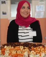  ??  ?? Lamiaa Hegab with one of the dishes she prepared.