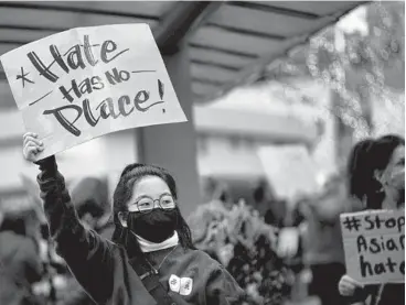  ?? RUTH FREMSON/THE NEW YORK TIMES ?? A ‘Stop Asian Hate’ rally is held Thursday in Bellevue, Washington. The shootings in the Atlanta area have generated anger over the country’s long-standing failure to address anti-Asian discrimina­tion.