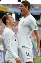  ??  ?? Thanks: Griezmann celebrates with Varane after the opener