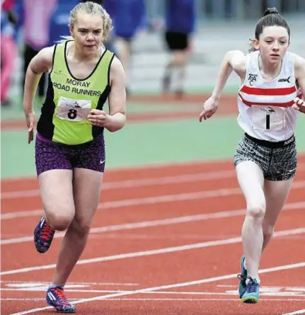  ??  ?? FAST START: Young athletes, from left, Lucy Evans, Adele Gillespie and winner Chloe Cheyne at the start of the