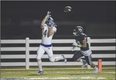  ?? (NWA Democrat-Gazette/Charlie Kaijo) ?? North Little Rock wide receiver Vaughn Phillips (left) scores as Springdale Har-Ber fullback Luke Adams blocks.