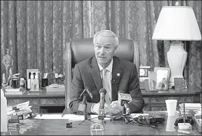  ?? Arkansas Democrat- Gazette/ JOHN SYKES JR. ?? Gov. Asa Hutchinson talks with reporters during a news conference in his office Tuesday afternoon at the state Capitol in Little Rock.