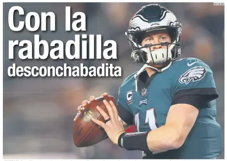  ?? AFP • M. LEFF ?? EN REPOSO. Carson Wentz no ha tomado parte de las prácticas de los Eagles en los últimos dos días y busca más opiniones en torno a su lesión de espalda.