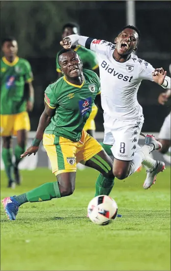  ?? PHOTO: LEE WARREN/GALLO IMAGES ?? Baroka defender Phineas Ravhuhali sends Wits’ Thabang Monare flying but it was the hosts who had the last laugh at Bidvest Stadium last night.