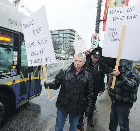  ?? JASON PAYNE/ PNG ?? A group of West Vancouver residents and business owners held a protest on Saturday in opposition to a plan to convert a traffic lane along Marine Drive into a bus-only lane, saying the proposal would create traffic issues and eliminate parking.