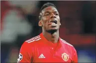  ?? DAVID KLEIN / REUTERS ?? Paul Pogba looks dejected after Manchester United was eliminated from the Champions League by Sevilla in their round of 16 second-leg-match at Old Trafford, Manchester, on Tuesday.