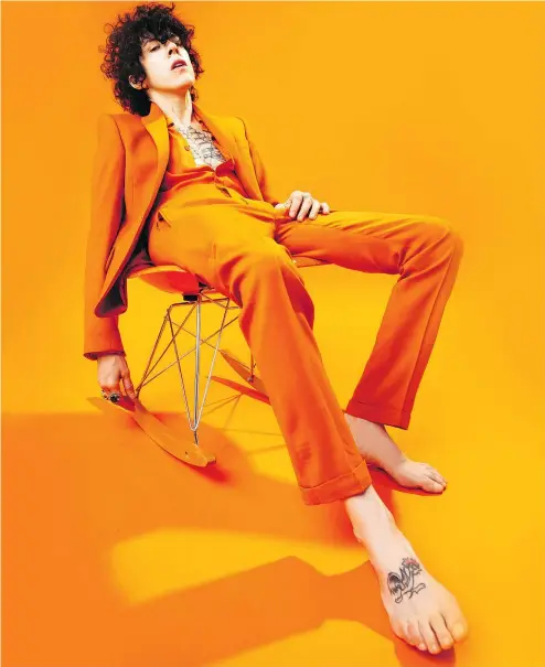  ??  ?? LP wears an orange suit that screams confidence on the cover of her new album Heart to Mouth.