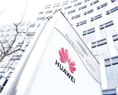  ??  ?? Logo of Huawei is seen in front of the local offices of Huawei in Warsaw, Poland. — Reuters photo