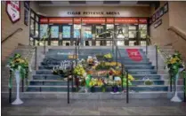  ?? LIAM RICHARDS — THE CANADIAN PRESS VIA AP ?? A memorial at the stairs that lead to Elgar Petersen Arena is shown in Humboldt, Saskatchew­an, on Saturday. Royal Canadian Mounted Police say 14 people are dead and others injured Friday after a truck collided with a bus carrying a junior hockey team...