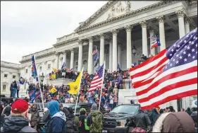  ?? JASON ANDREW / NEW YORK TIMES FILE (2021) ?? Supporters of then-president Donald Trump storm the Capitol in Washington on Jan. 6, 2021. Days before the end of the 2020 election, a team of FBI analysts tried to game out the worst outcomes of a disputed election. One they never thought of came to pass: a violent mob mobilizing in support of Donald Trump.