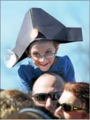  ?? GENE WALSH — DIGITAL FIRST MEDIA ?? A boy wearing a tricorn hat smiles as he watches General George Washington cut his birthday cake during the annual President’s Day celebratio­n at Valley Forge National Historical Park Monday.