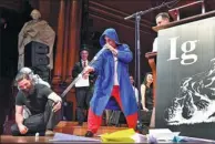  ?? GRETCHEN ERTL / REUTERS ?? Didgeridoo instructor Alex Suarez performs at the Ig Nobel Prize spoof awards at Harvard University.