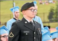  ?? JESI YOST — FOR DIGITAL FIRST MEDIA ?? Christophe­r Rulli stands for acknowledg­ment of students in the military during Daniel Boone High School’s commenceme­nt ceremony on Friday evening.