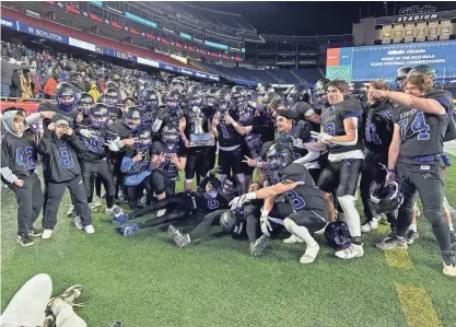  ?? PHOTO/RICH GARVEN ?? West Boylston football players celebrate winning the Division 8 Super Bowl by defeating Carver at Gillette Stadium on Wednesday.
