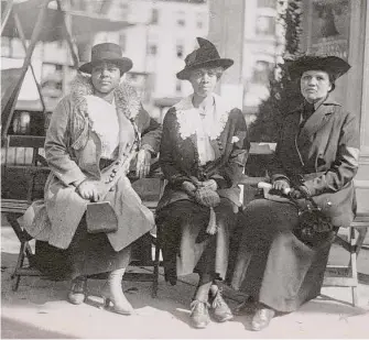  ?? New Haven Museum/Contribute­d photo ?? Above, a photo of The Colored Women’s Liberty Loan Committee from the New Haven Museum. At left, Brittney Yancy, a history professor who worked on researchin­g Connecticu­t women of color who fought for the vote, celebrates a plaque in the state Capitol celebratin­g 27 of those pioneers of 100 years ago or more. The plaque above it, placed in 1934, focused on white women of the suffrage movement.