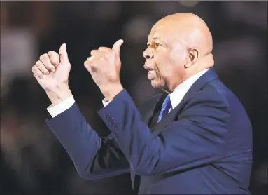  ?? Robyn Beck / AFP via Getty Images ?? U.S. Rep. Elijah Cummings gestures during the first day of the Democratic National Convention at the Wells Fargo Center in Philadelph­ia on July 25, 2016. Cummings, who was at the center of the Trump impeachmen­t inquiry, died on Thursday at the age of 68.