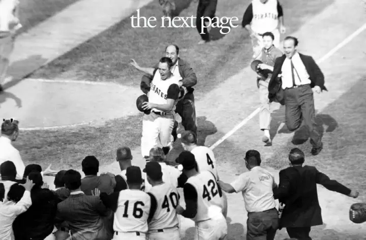  ?? Harry Harris/Associated Press ?? Fans rush onto the field toward the Pittsburgh Pirates’ Bill Mazeroski on Oct. 13, 1960, as he comes home on his Game 7-ending home run in the ninth inning to win the World Series against the New York Yankees in Pittsburgh.