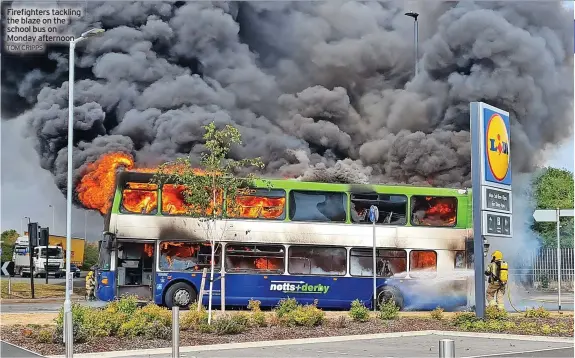  ?? TOM CRIPPS ?? Firefighte­rs tackling the blaze on the school bus on Monday afternoon