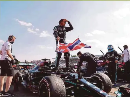  ?? AFP PIC ?? Mercedes-AMG Petronas driver Lewis Hamilton celebrates after winning the British Grand Prix at Silverston­e on Sunday.