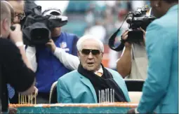  ?? BRYNN ANDERSON ?? FILE - In this Dec. 22, 2019, file photo, former Miami Dolphins head coach Don Shula looks at a large cake celebratin­g the 1972 undefeated season and his birthday during half time at an NFL football game against the Cincinnati Bengals in Miami Gardens, Fla.