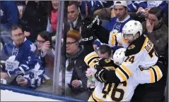  ?? THE CANADIAN PRESS/FRANK GUNN ?? Boston Bruins left wing Jake DeBrusk (74) celebrates his goal with teammate Boston Bruins centre David Krejci (46) during the third period of Thursday’s NHL playoff game in Toronto.