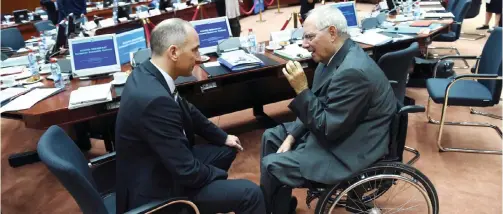  ??  ?? BRUSSELS: German Finance Minister Wolfgang Schauble (right) speaks with Liechtenst­ein Prime Minister Adrian Hasler during an Economic and Financial Affairs Council (ECOFIN) meeting at the European Council, in Brussels yesterday. — AFP