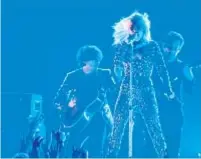  ?? Robert Gauthier Los Angeles Times ?? LADY GAGA performs at this month’s Grammys with “Shallow” collaborat­ors Anthony Rossomando, left, and Mark Ronson.