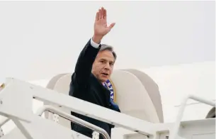  ?? Associated Press ?? ■ Secretary of State Antony Blinken waves Monday as he departs at Andrews Air Force Base, Md. Blinken is going to the Middle East.