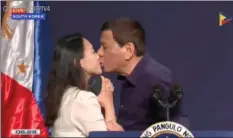 ?? PTV VIA AP ?? In this video from PTV taken Sunday on June Philippine­s President Rodrigo Duterte leans in to kiss a Filipino worker at the podium during a town hallstyle meeting with overseas Filipino workers in Seoul, South Korea.