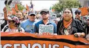  ?? TASOS KATOPODIS/EPA ?? Actor Leonardo DiCaprio, center, participat­es in the Peoples Climate March on Saturday in Washington, D.C.