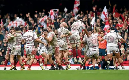  ?? GETTY IMAGES ?? Georgia players celebrate their historic win over Wales in Cardiff yesterday.