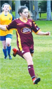  ??  ?? Lilly Carrison moves in on a loose ball. Lilly scored the first goal of the women’s game.