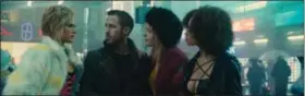  ?? PHOTO COURTESY OF COURTESY OF ATOMIC FICTION ?? Shown from left are, Krista Kosenen as Doxie #2, Ryan Gosling as K, Mackenzie Davis as Mariette and Elarica Johnson as Doxie #3 in “Blade Runner 2049.”