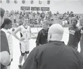  ?? WELLS DUSENBURY/STAFF PHOTO ?? The captains for Atlantic and Boca Raton meet up before the start of Tuesday night’s game.